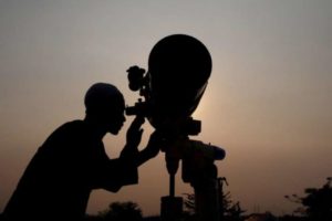 An officer looks for the position of the new moon in order to determine the first day of the holy month of Ramadan in Jakarta. (Reuters)